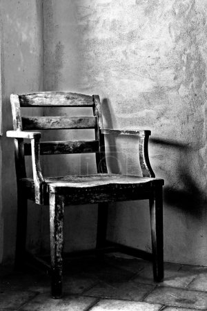 grunge room with wooden chair in corner