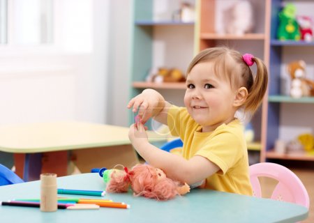 Little girl play in preschool