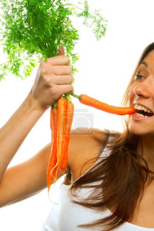 Woman holding bunch of carrots