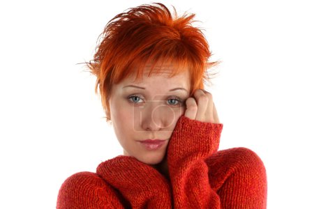 Sad red haired woman isolated on white background