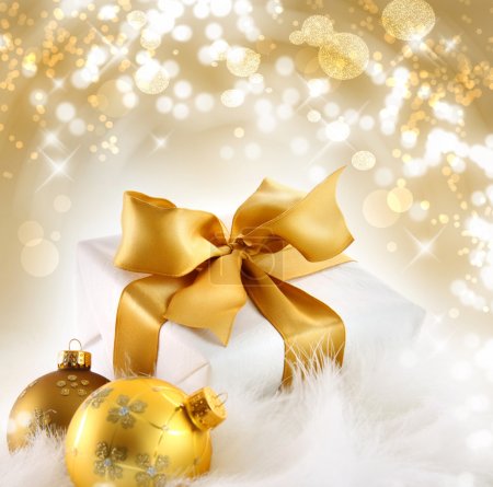 Gold ribbon gift with holiday background