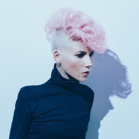 sensual woman with fashionable hairstyle Colored hair trend