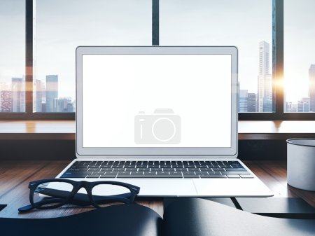 Photo of generic laptop on a workspace