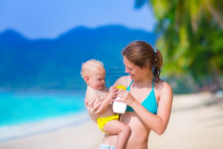 Mother and baby at a beach
