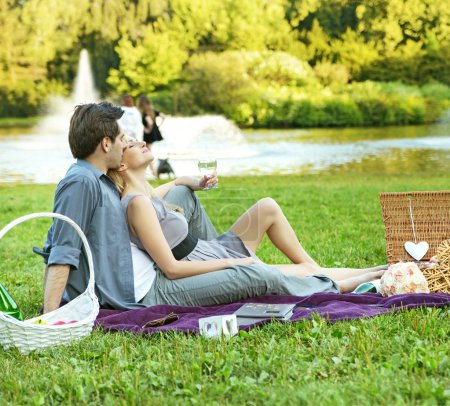 Cheerful couple relaxing in the park