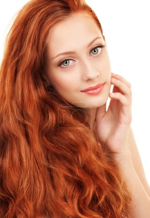 Portrait of a young woman with red hair and green eyes
