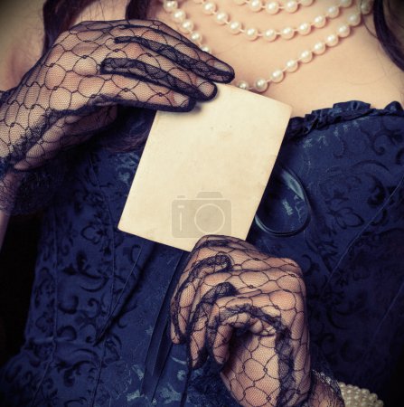 Woman  holding  vintage  paper sheet
