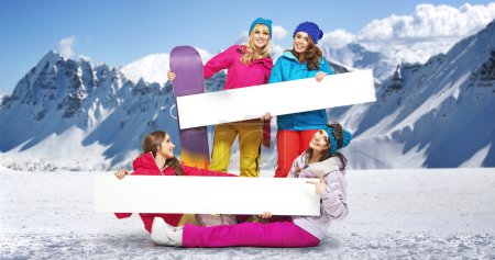 Group of female snowboarders with bright boards
