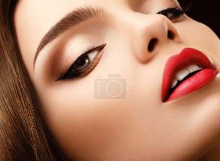 Woman Eye with Beautiful Makeup. Red Lips High quality image.