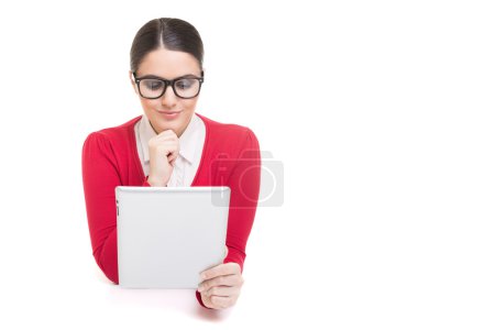 Female boss in red using digital tablet