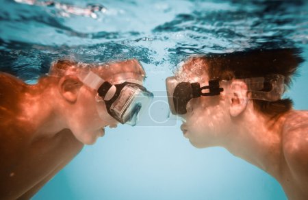 Teenagers under water