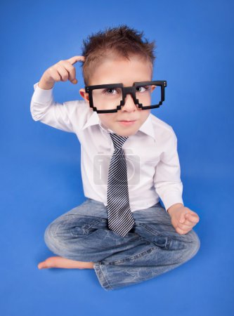 Six years boy wearing geek glasses