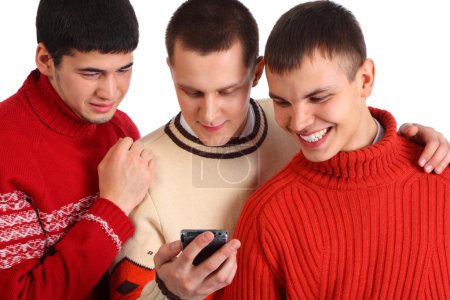 Three friends look on handheld computer