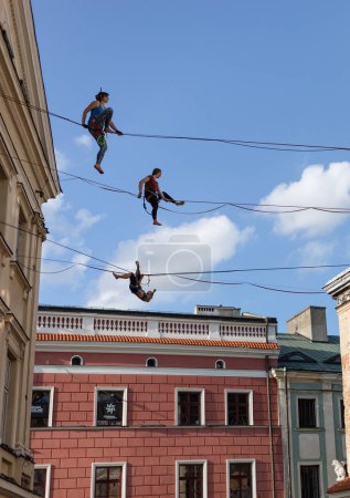 Lublin, Poland - Jul 27, 2018: Rope walkers at urban highline festival placed in city space of Lublin. Lublin is the ninth largest city in Poland.