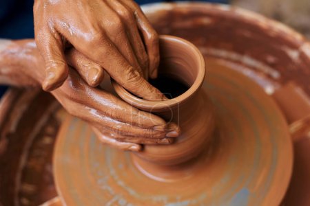 master making clay pottery