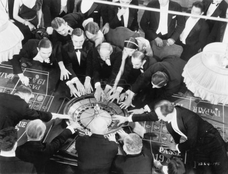High angle of a group of playing roulette
