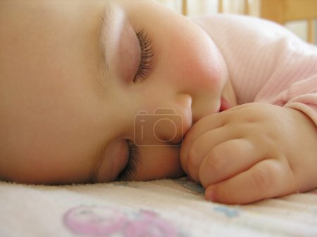 Sleeping baby with hand