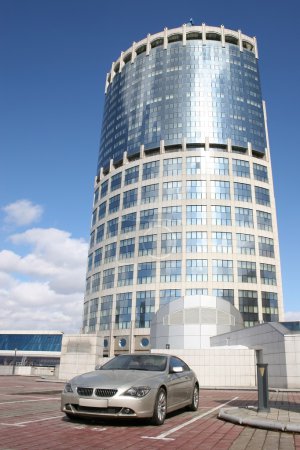 Car and office building