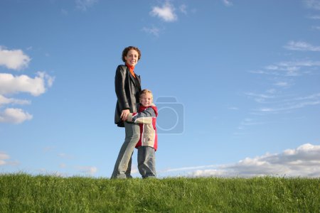 Mother with son on grass