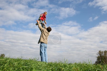 Fly child on father's hands