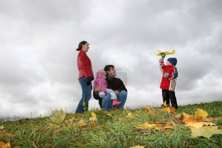 Autumn family with plane