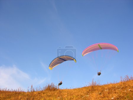 Two paraglider