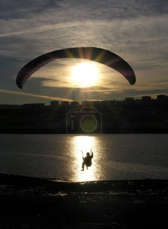 paraglider silhouette sundown