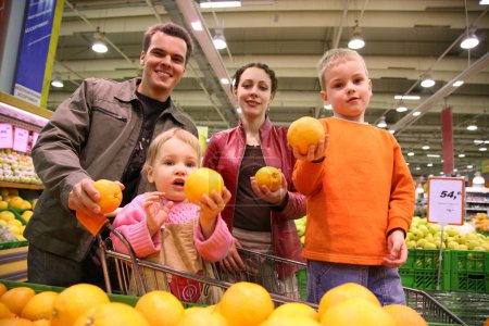 Family with oranges