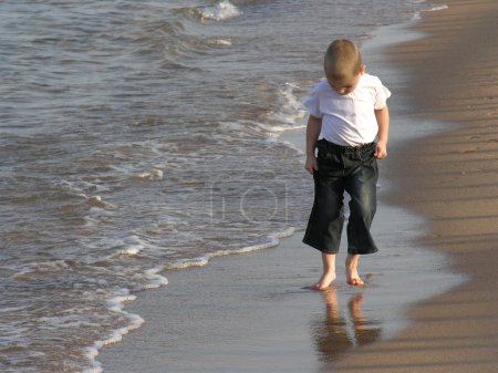 Child walk on beach