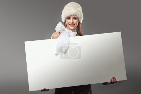 Young happy woman over white board