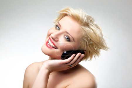 Blonde beauty speaking the phone