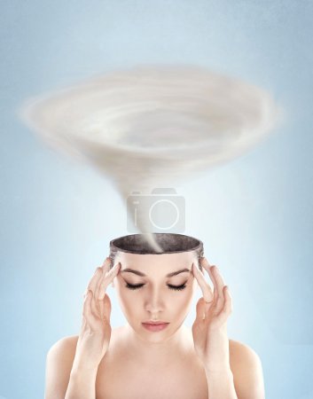 Conceptual picture - tornado in woman's head