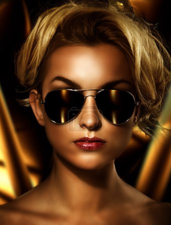Young attractive blonde wearing stylish sunglasses