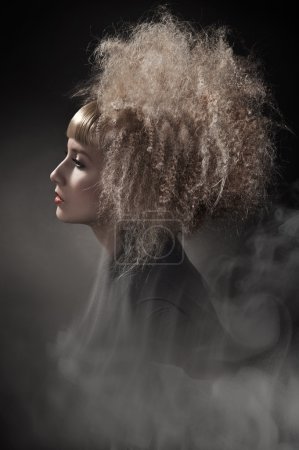 Smoky photo of a woman with gorgeous hair