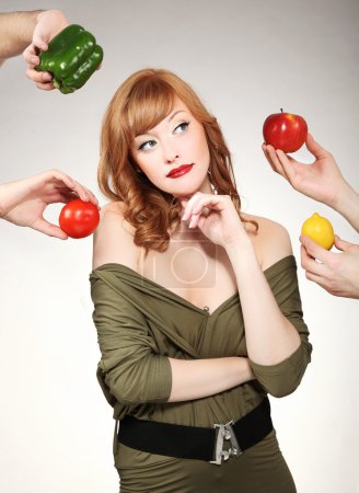 Beautiful woman making a vegetable choice