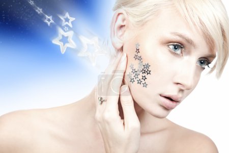 Beauty portrait of a young woman with stars