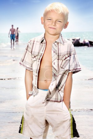 Young boy posing on the beach