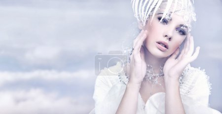 Beauty woman over winter background