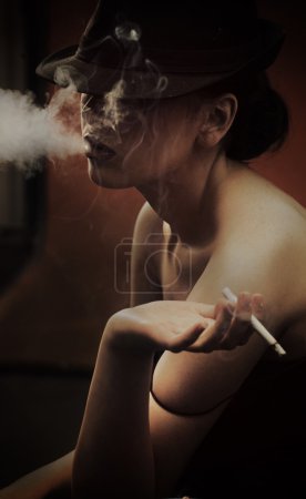 Fine art portrait of a beautiful lady with cigarette