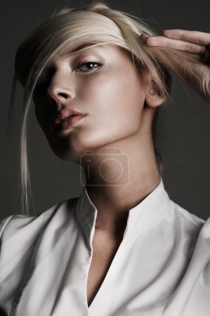 Young attractive blond female with creativity hairstyle