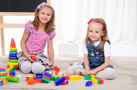 Two little girls play