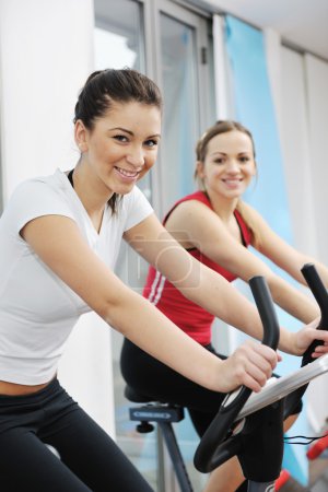 Woman workout in fitness club on running track