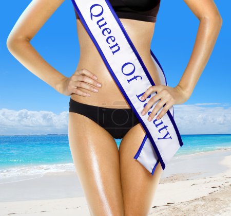 Part of woman shape of beautiful thigh in bikini with white tape of beauty contest