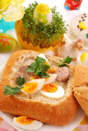 White borscht with eggs and sausage in bread bowl for easter