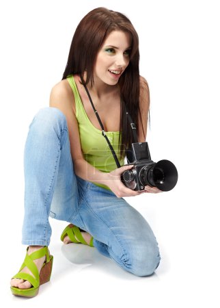Beautiful young woman with camera.