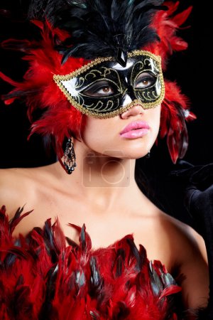 Young sexy woman in violet party half mask. may be use for fashi