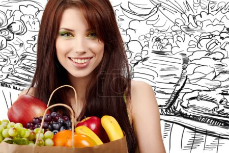 Smiling woman with fruits and vegetables. Over white background