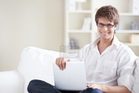 A young man with laptop