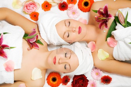 Two girls relaxing in a wellness