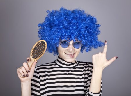 Coquette blue-hair girl with comb.